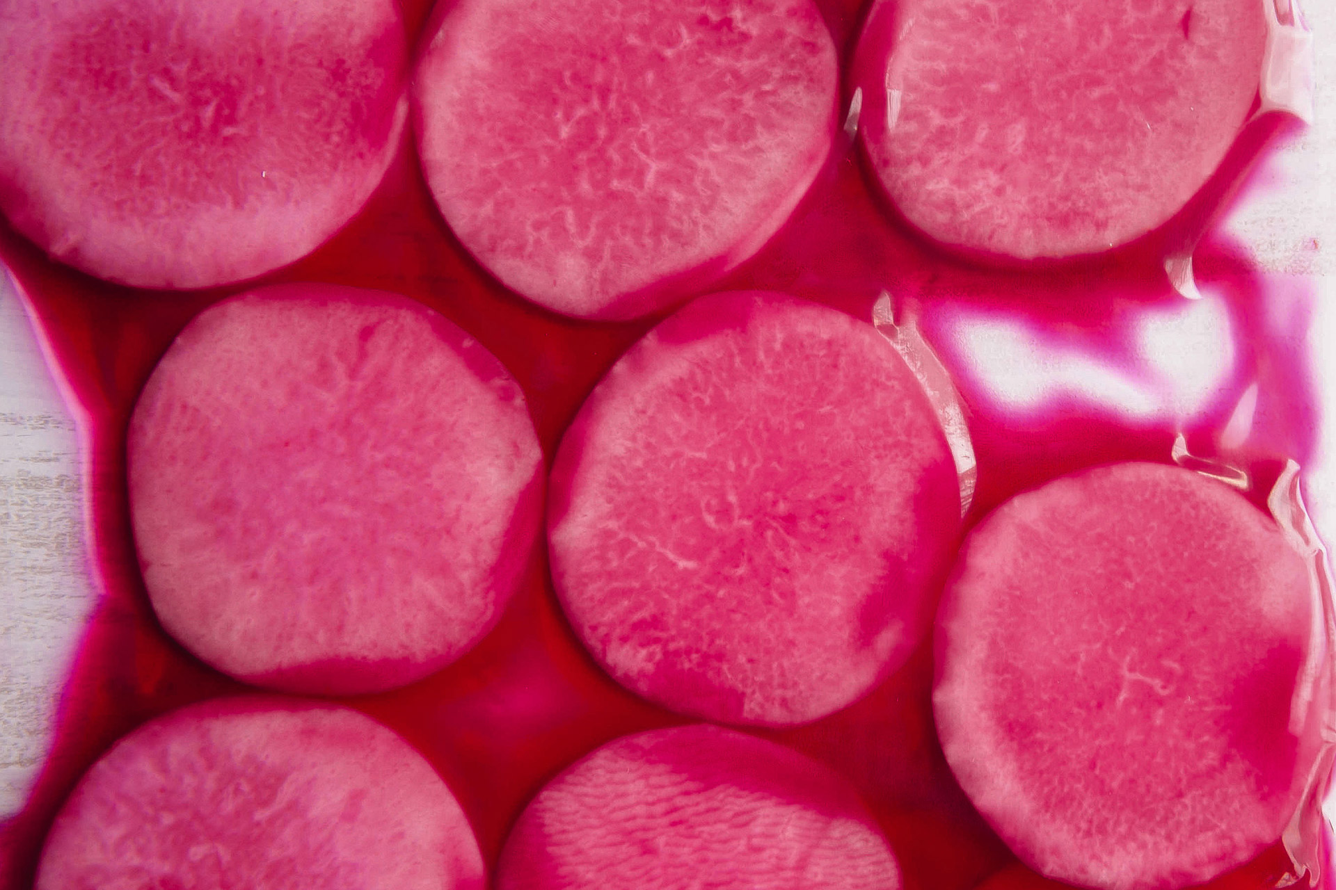 Vibrant Pink Radish Slices - Fresh Food Photography Background